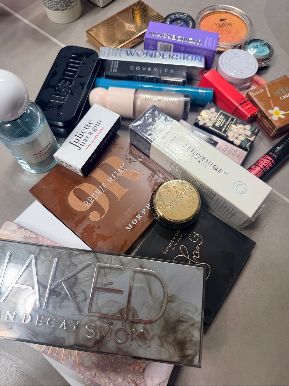Urban Decay Makeup Assortment with Coral, Pink, Gold, Brown Accents